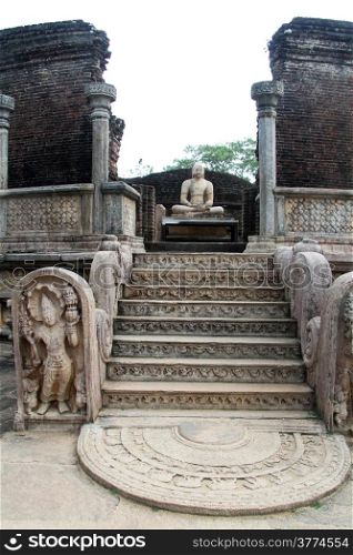 Moon stone and seated Buddha in vatadage in Polonnaruwa, Sri Lanka