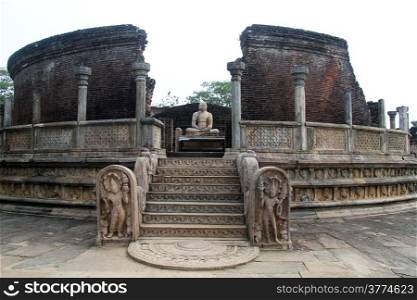 Moon stone and Vatadage temple with Buddha in Polonnaruwa, Sri Lanka