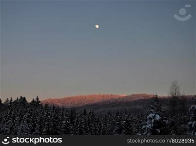 Moonrise in winter scenery
