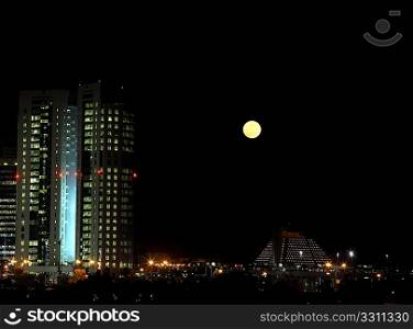 Moonrise over the distinctive West Bay district of Doha, Qatar, December 21, 2010.