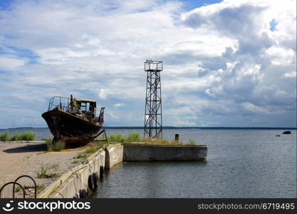 Mooring and boat on a background of clouds