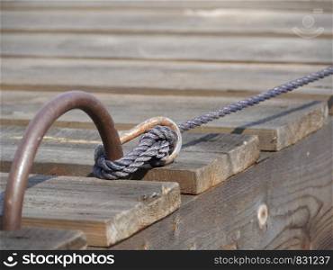 mooring rope tied to the pier close to