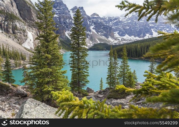 Moraine Lake, a glacially-fed lake in Banff National Park, Alberta, Canada, situated in the Valley of the Ten Peaks. Surrounded by the snow covered peaks of the Rocky Mountains.