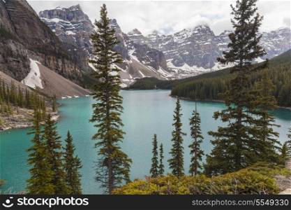 Moraine Lake, a glacially-fed lake in Banff National Park, Alberta, Canada, situated in the Valley of the Ten Peaks. Surrounded by the snow covered peaks of the Rocky Mountains.