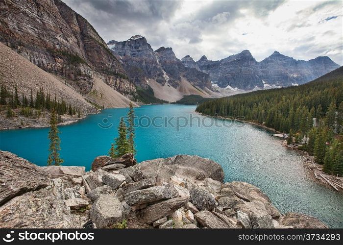 Moraine lake in the rocky mountains on a cloudy day