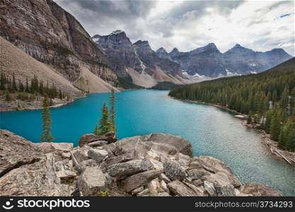 Moraine lake in the rocky mountains on a cloudy day