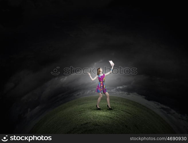 More colors. Young girl in multicolored bright dress and hat