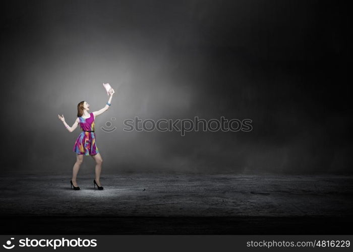 More colors. Young girl in multicolored bright dress and hat