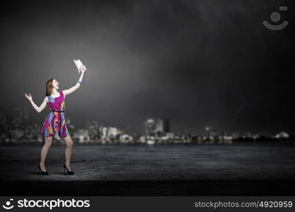 More colors. Young girl in multicolored bright dress and hat