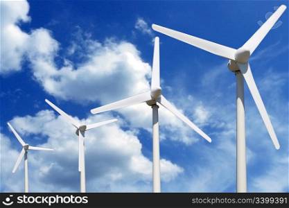 more wind turbines online blue sky with clouds