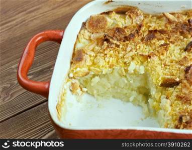 Mormon Funeral Potatoes - traditional potato hotdish, or casserole, un Intermountain West region of the United States. potatoes, cheese , onions, cream soup, cream sauce, sour cream, and corn flakes or crushed potato chips