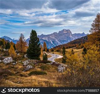 Morning autumn alpine Dolomites mountain scene. Peaceful view near Valparola and Falzarego Path, Belluno, Italy. Picturesque traveling, seasonal, nature and countryside beauty concept scene.