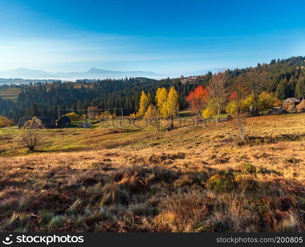 Morning autumn slopes  with colorful trees  of Carpathian Mountains  Yablunytskyj Pass, Ivano-Frankivsk oblast, Ukraine .