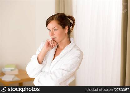 Morning bedroom - woman in bathrobe waking up