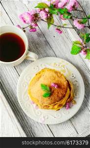 Morning breakfast with pumpkin pancakes and cup of coffee. pancakes with pumpkin