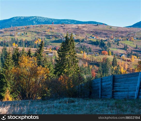 Morning Carpathian mountains and village hamlets on slopes  Yablunytsia village and pass, Ivano-Frankivsk oblast, Ukraine .