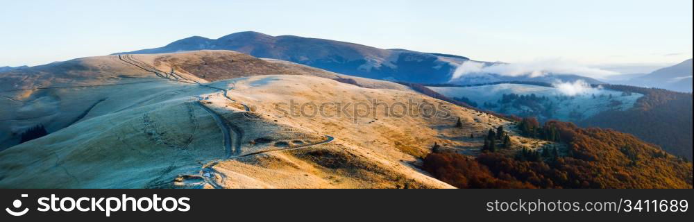 Morning Carpathian Mountains (Ukraine) autumn landscape with country road. Three shots stitch image.