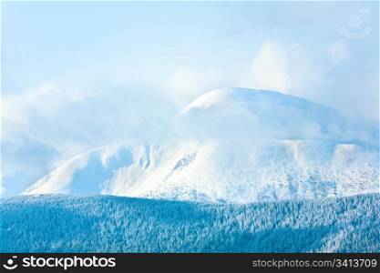 Morning cloudy winter mountain landscape. View from Kukol Mount. (Carpathian Mountains, Ukraine)