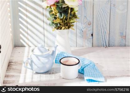 Morning cocoa cup on the kitchen table in shabby chic style. Morning cocoa cup