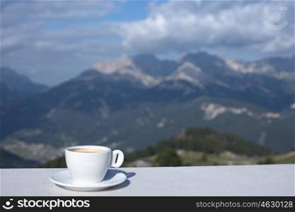 Morning coffe cup with mountain view