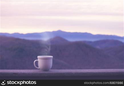 Morning coffee cup with alpine mountain view