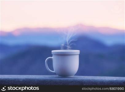 Morning coffee cup with alpine mountain view