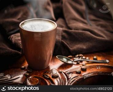Morning coffee on dark rustic table, close up