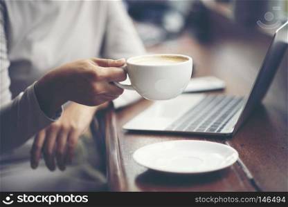Morning coffee. Woman holds a coffee cup, business concept