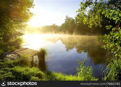Morning fishing on a beautiful river in forest