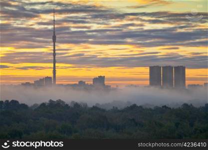 morning fog at autumn city sunrise