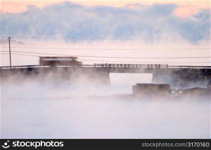 Morning Fog Enveloping A Rural Bridge