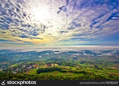 Morning fog in green hills aerial view, Kalnik region of Croatia