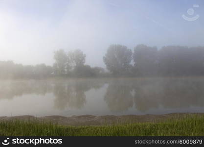 morning fog in loire river, france