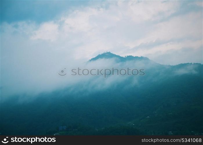 Morning fog landscape with mountains and sky