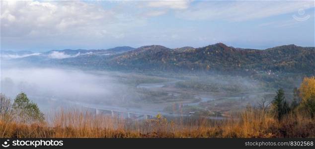 Morning fog on country foothills above Opir and Stryi rivers, and slopes of the Carpathian Mountains in far, Ukraine.