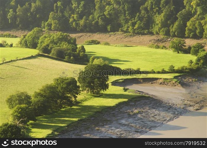 Morning landscape with fields and shadows, River Wye at the Lancaut Peninsula, Gloucestershire, England, United Kingdom.