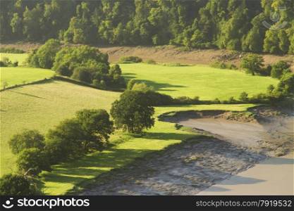 Morning landscape with fields and shadows, River Wye at the Lancaut Peninsula, Gloucestershire, England, United Kingdom.