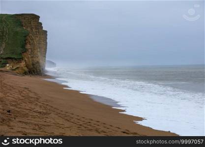Morning light on a stormy day on the cliffs at West Bay Dorset England UK