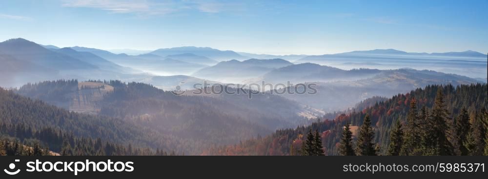 Morning mist in mountains. Sunrise and autumn mist over the hills. Ukraine Carpathians