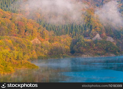 Morning Mist with Autumn Fall Lake and Forest at Tamagawa Dam in Akita Tohoku Japan