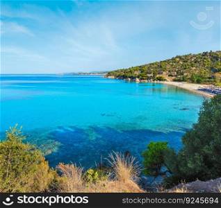 Morning sandy Kaviou beach. Summer top view (Nikiti, Sithonia, Halkidiki, Greece). People are unrecognizable.