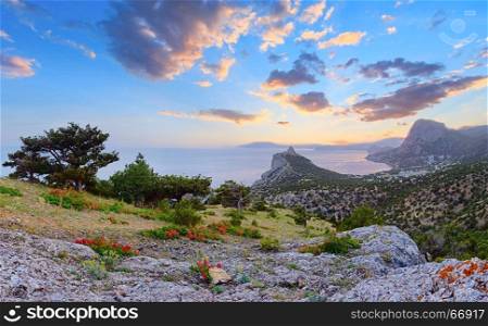Morning sea landscape with coastline rocks of Novyj Svit reserve (Crimea, Ukraine) and picturesque sunrise sky
