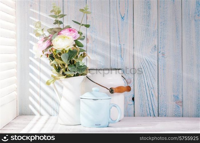 Morning still life on shabby chic table and light from the blinds. Morning still life