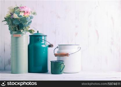 Morning still life with green utensils on shabby chic table and light from the blinds. Morning kitchen still life