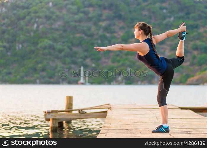 Morning stretching outdoors at the sea