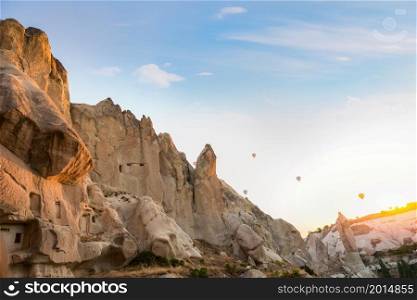 Morning sun over caves in rocks of Cappadocia, Turkey. Morning in Cappadocia