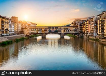 Morning sun over Vecchio bridge in Florence