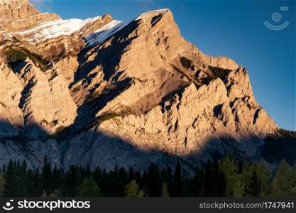 Morning sunlight illuminating Mount Kidd in Kananaskis Country of Alberta Canada.