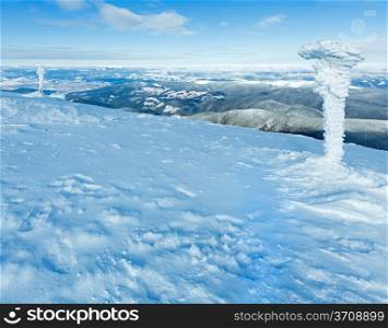 Morning sunny winter mountain landscape and snowbound pillars(Carpathian, Ukraine).
