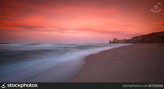 Morning Sunrise at coastal cliff face rock formation of Twelve Apostle, VIC. Oat Vaiyaboon